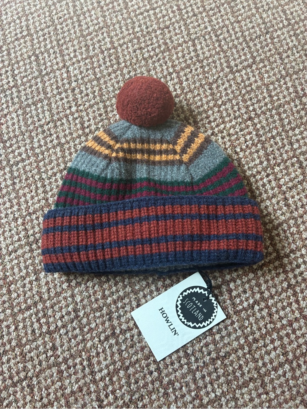Howlin Striped Wool Pom Beanie in Rust & Grey